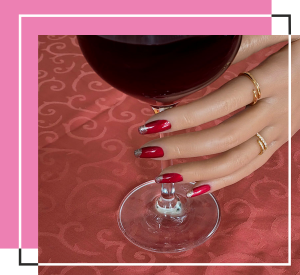 Vine red glitter nails with golden tops.